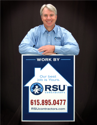 man standing behind a podium
